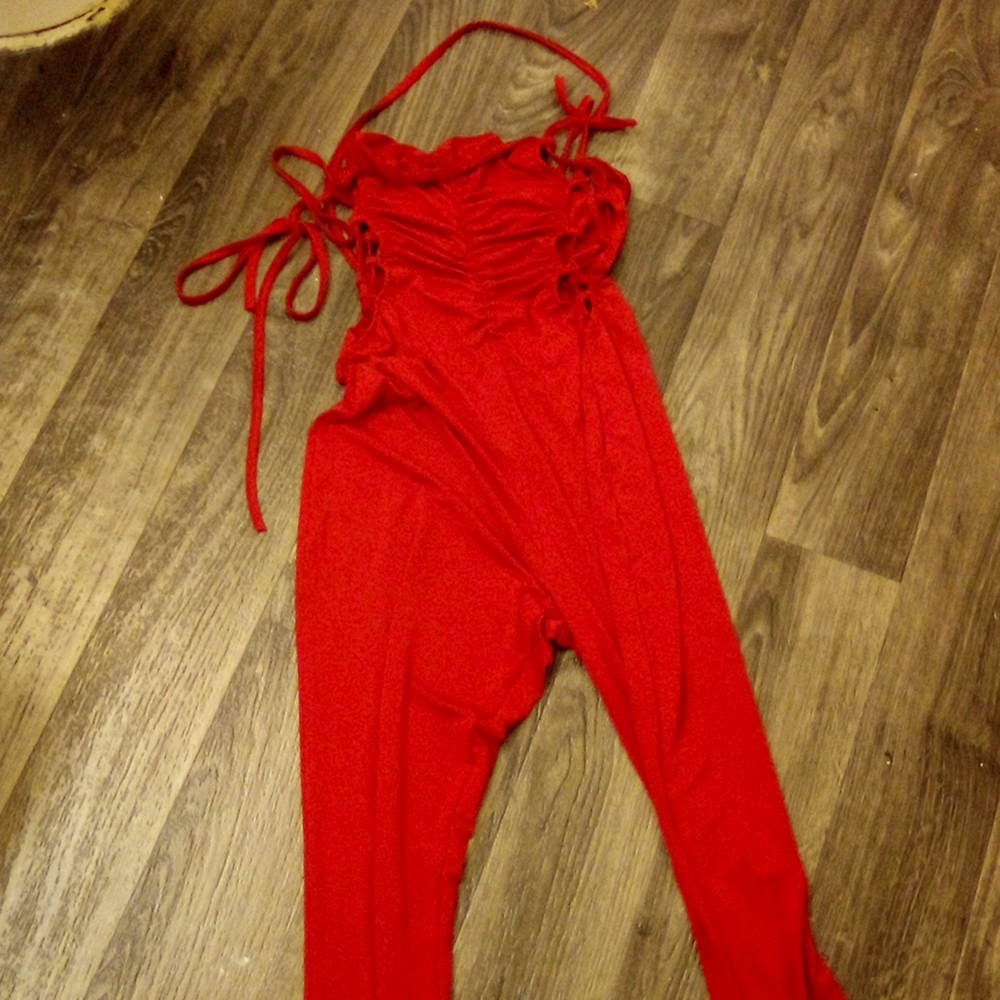 Nice onesie with side strings and back out. Sexy night out or club scene.